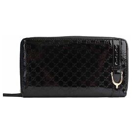 Gucci Portafoglio zippato in pelle verniciata nera con dettagli dorati