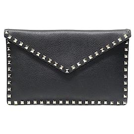 Valentino Clutch busta in pelle nera con borchie dorate Rockstud