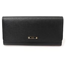 Fendi Cartera larga de piel negra con botón dorado