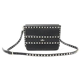 Clutch aus schwarzem Kalbsleder mit goldfarbenen Rockstuds - Valentino