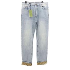 Gucci Pantaloni in denim con etichetta in pelle per uomo