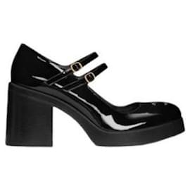 Botas de tornozelo em couro envernizado - Céline