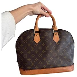 Borsa a mano Louis Vuitton Alma in pelle marrone