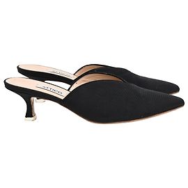 Le mules a punta affilata con tacco kitten The Attico in tela nera