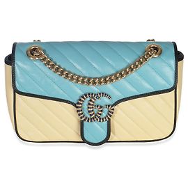 Borsa GG Marmont piccola in pelle di vitello matelassé blu e gialla con torchon diagonale di Gucci