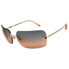 Gafas de sol sin montura Chanel logo plateado naranja azul tintado 4017