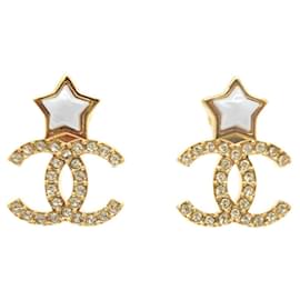 Orecchini a stella dorati e bianchi Chanel