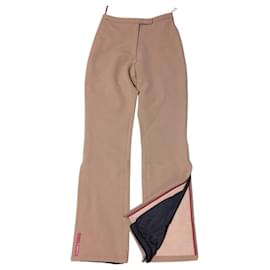 Pantalones de nylon beige tan con logo rojo Prada Linea Rossa