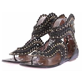 Schwarze und goldene flache Sandalen - Alaïa