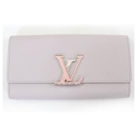 Cartera Capucines LV de cuero de pitón Louis Vuitton
