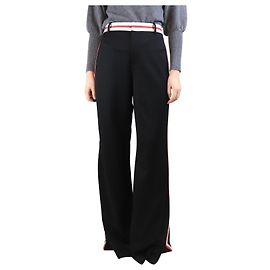Alice + Olivia Calças pretas com listras laterais - tamanho UK 18