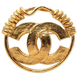 Spilla rotonda CC in oro placcato di Chanel