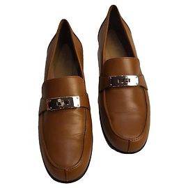 Mocassins en cuir marron Hermès avec quincaillerie en argent