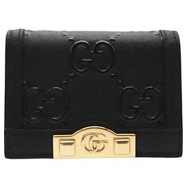 Billetera de cuero con relieve GG de Gucci