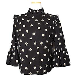 Alice + Olivia Blusa negra con volantes Alice y Olivia