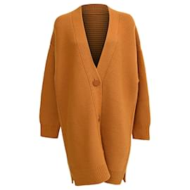Cárdigan de lana en naranja óxido con botones de Hermès