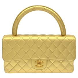 Borsa a mano in pelle di agnello dorata Chanel