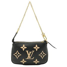 Pochette Accessorio Monogram Empreinte Bicolore Louis Vuitton