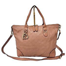 GUCCI Borsa a mano con manico superiore in pelle Guccissima con charm a forma di cuore grande - Pesca