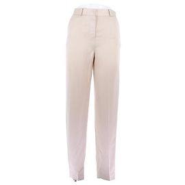 Totême Pantaloni crema satinati