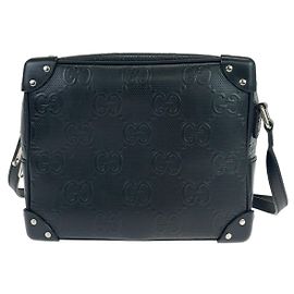 Sac à bandoulière en cuir embossé GG Gucci