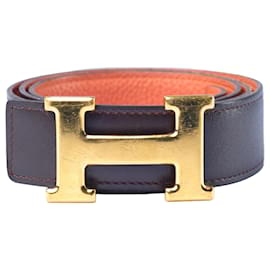 Cintura reversibile H in pelle Togo e Box arancione/cioccolato di Hermès