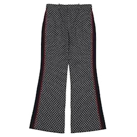 Gucci Pantalones acampanados cortos con estampado del logo GG