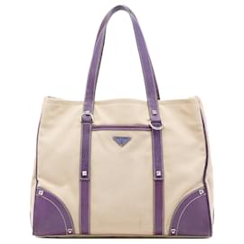 Borsa tote in tela con tasca frontale in pelle marrone con borchie Prada