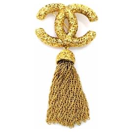 Spilla in metallo dorato Chanel