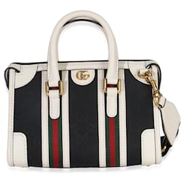 Bolso mini Double G de lona negra y blanca de Gucci