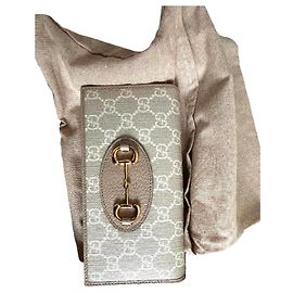 Cartera Gucci Horsebit 1955 en lona GG beige y cuero
