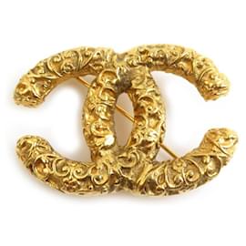 Spilla in metallo dorato Chanel