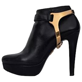 Botines de cuero negro Prada con herrajes dorados, talla 36, de segunda mano