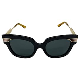 Übergroße Sonnenbrille aus Acetat und Metall mit Gucci Web Detail in Schwarz / Gold / Rot / Grün und GG-Logo