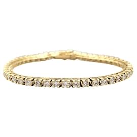 Autre Marque Bracciale a linea in oro giallo e diamanti.
