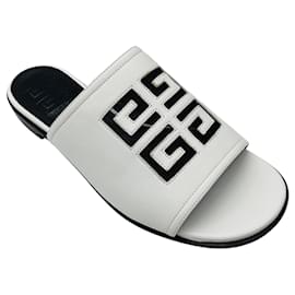 Mule piatte in pelle con logo 4G bianco di Givenchy