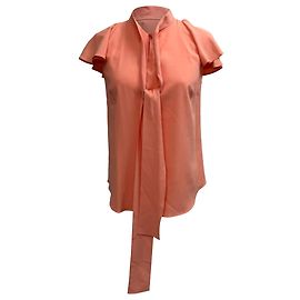 Blusa in seta corallo con colletto a fiocco e maniche corte Oscar De La Renta