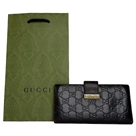 Cartera larga de cuero monograma Gucci vintage marrón
