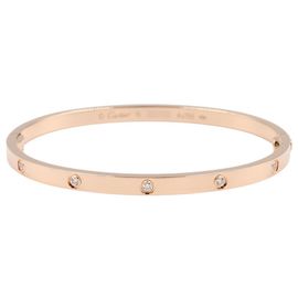 Bracciale charm Cartier in oro rosa 18K con diamanti