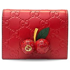 Billetera bifold de cuero Guccissima rojo cereza Gucci