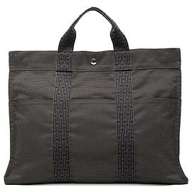 Hermès Bolsa Herline MM en lona gris