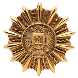 Spilla placcata in oro con il logo Coco di Chanel