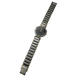 Montre en acier bicolore à quartz vintage Yves Saint Laurent OFF