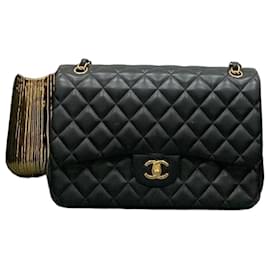 Borsa Chanel in pelle di agnello nera con catena dorata