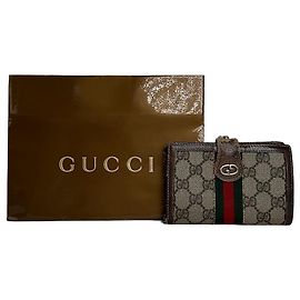 Cartera bifold de lona GG vintage de Gucci beige y marrón