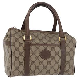 Sac Boston en PVC beige et or de la ligne Sherry GG Supreme de GUCCI Auth ep14457