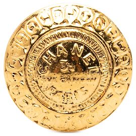 Broche redonda dourada banhada a ouro Chanel 31 Rue Cambon