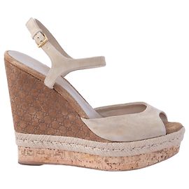 Sandali con zeppa Hollie in suede e sughero Guccissima di Gucci