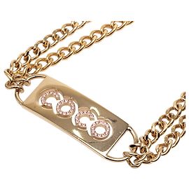 Doppelketten-Gürtel aus vergoldetem Material mit Coco-Plakette aus Strass von Chanel