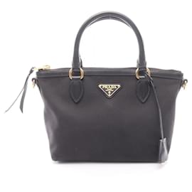 Bolso de mano Prada negro de piel y lona